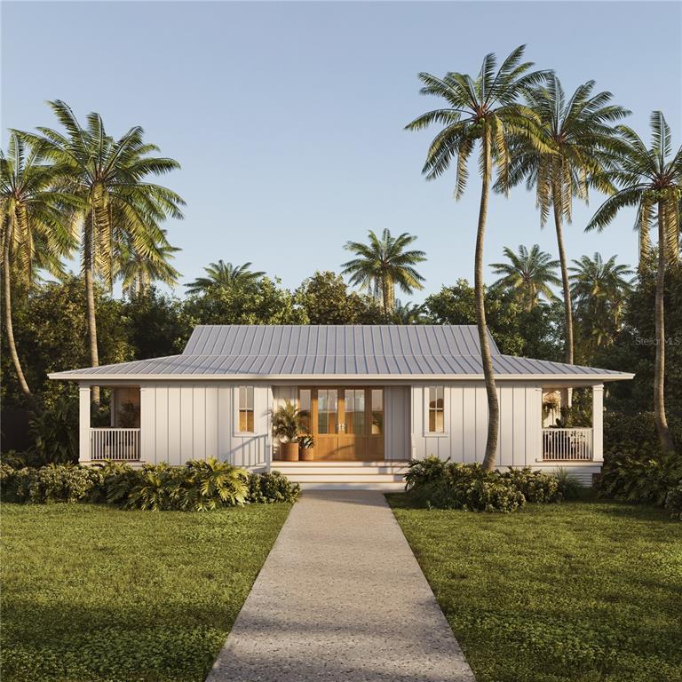 front view of a house with a yard and potted plants