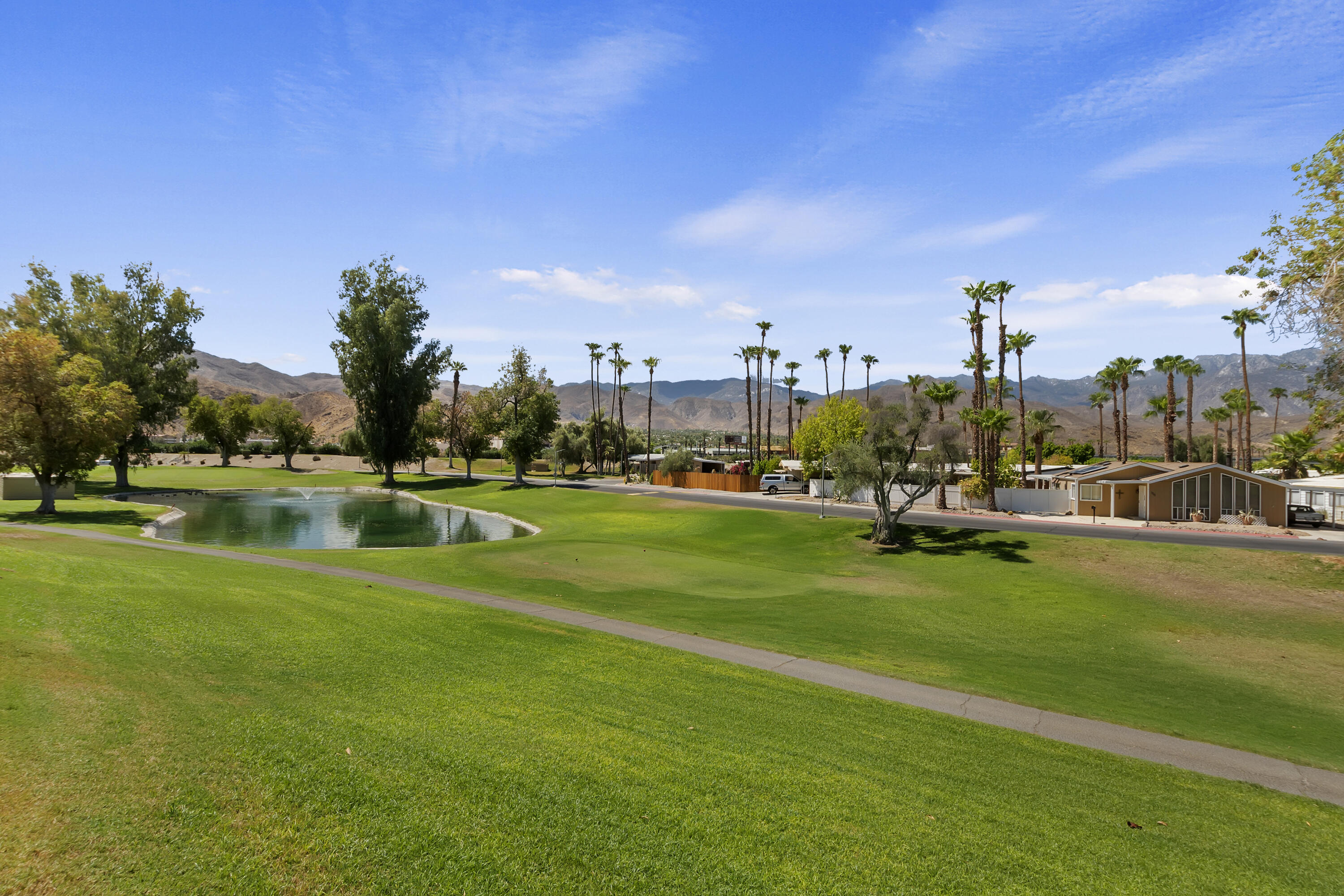 a view of a park with houses