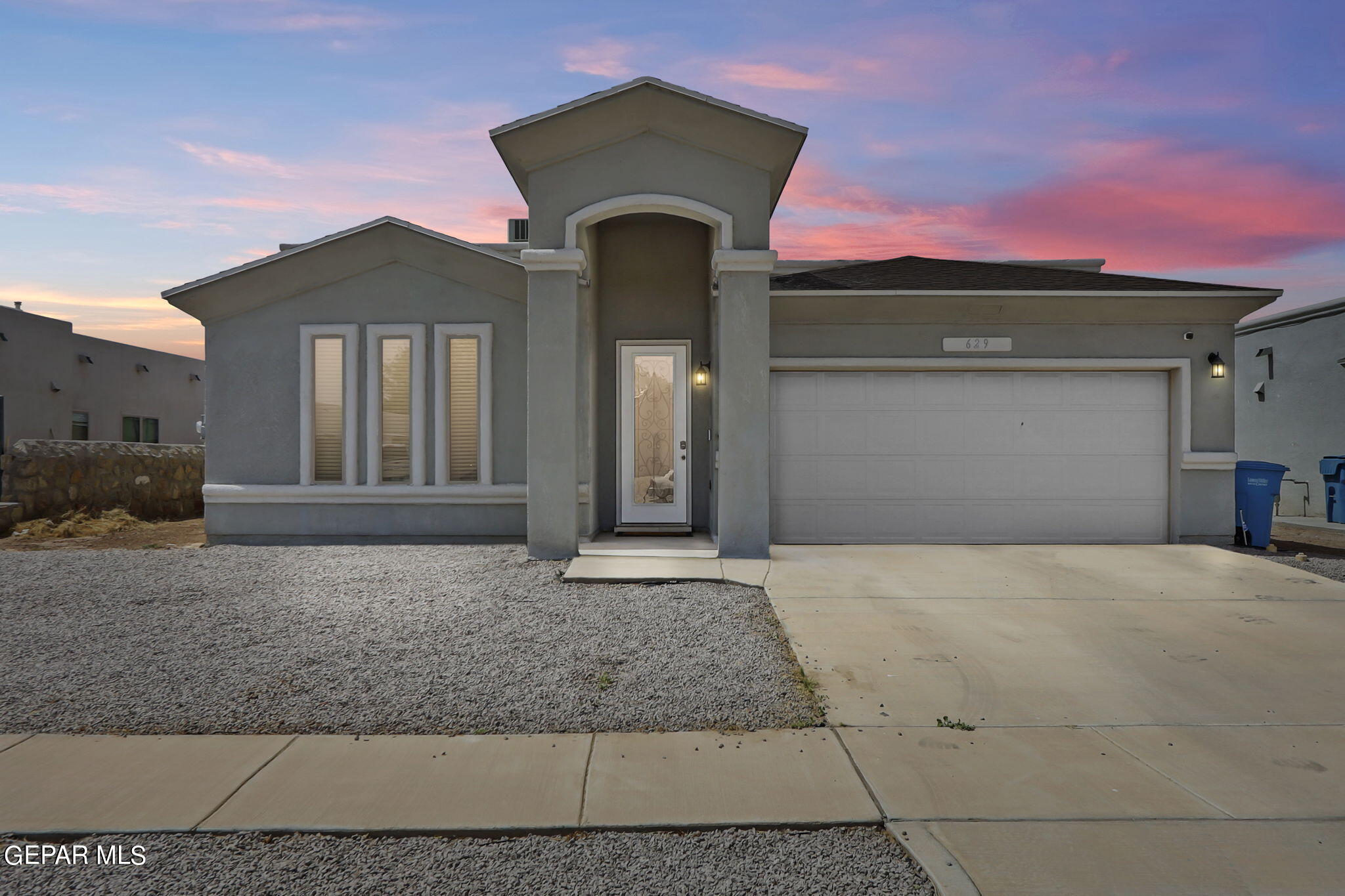 a front view of a house with yard