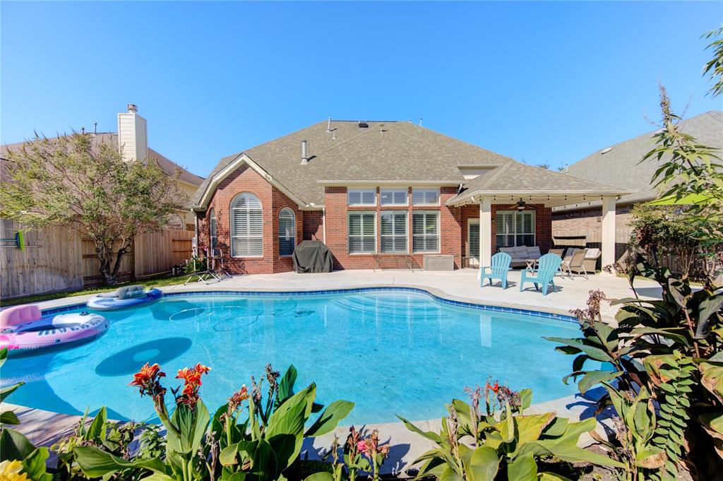 a view of a house with swimming pool