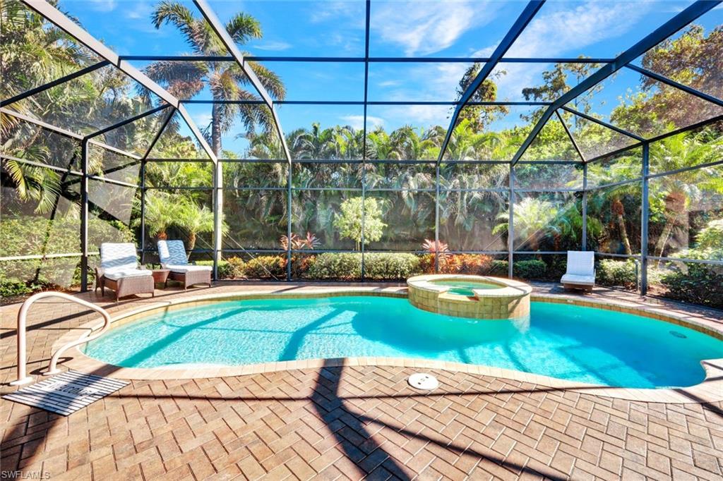 a view of a swimming pool with a patio