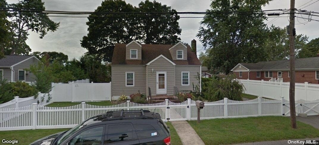 a view of multiple houses with a yard