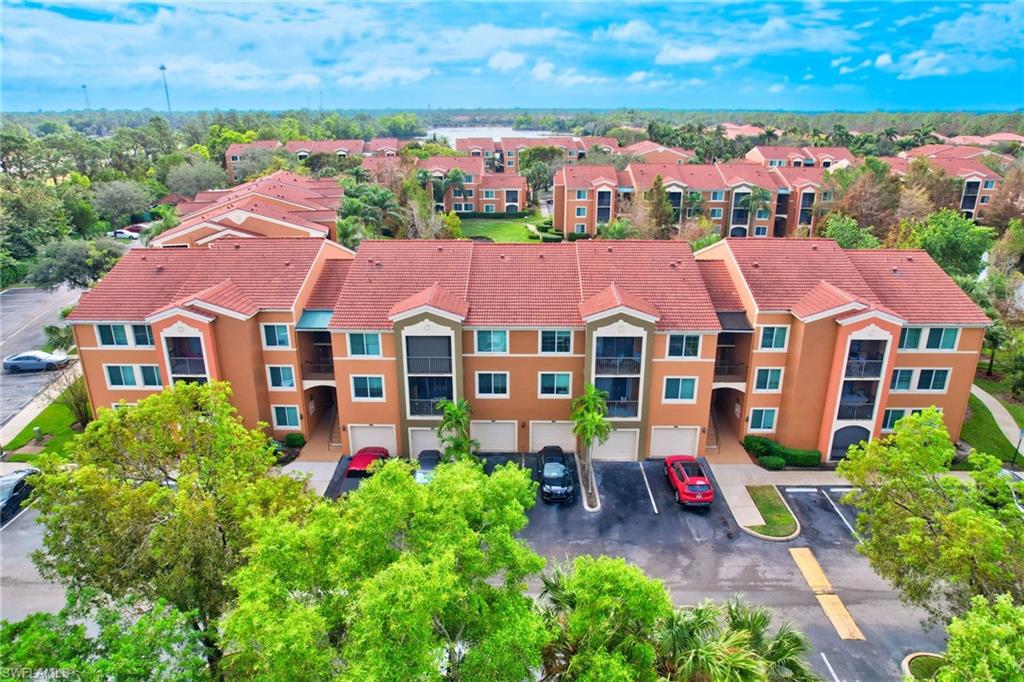 an aerial view of multiple houses with yard