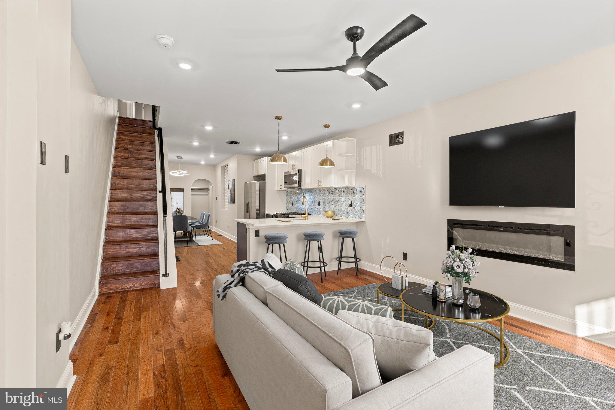 a living room with furniture and a flat screen tv