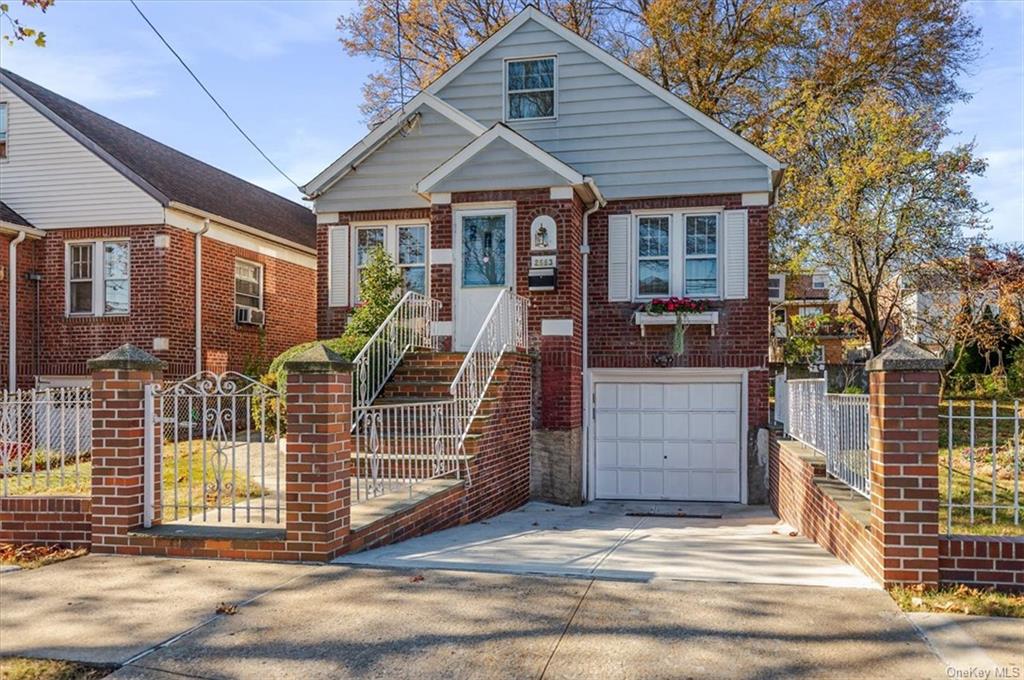 Bungalow-style house with a garage and cooling unit