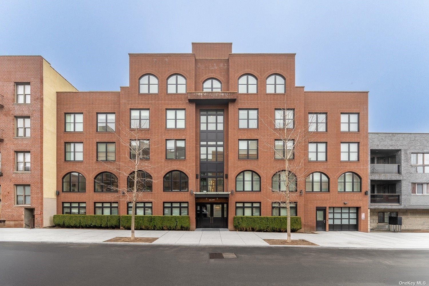 a front view of a building with lot of windows