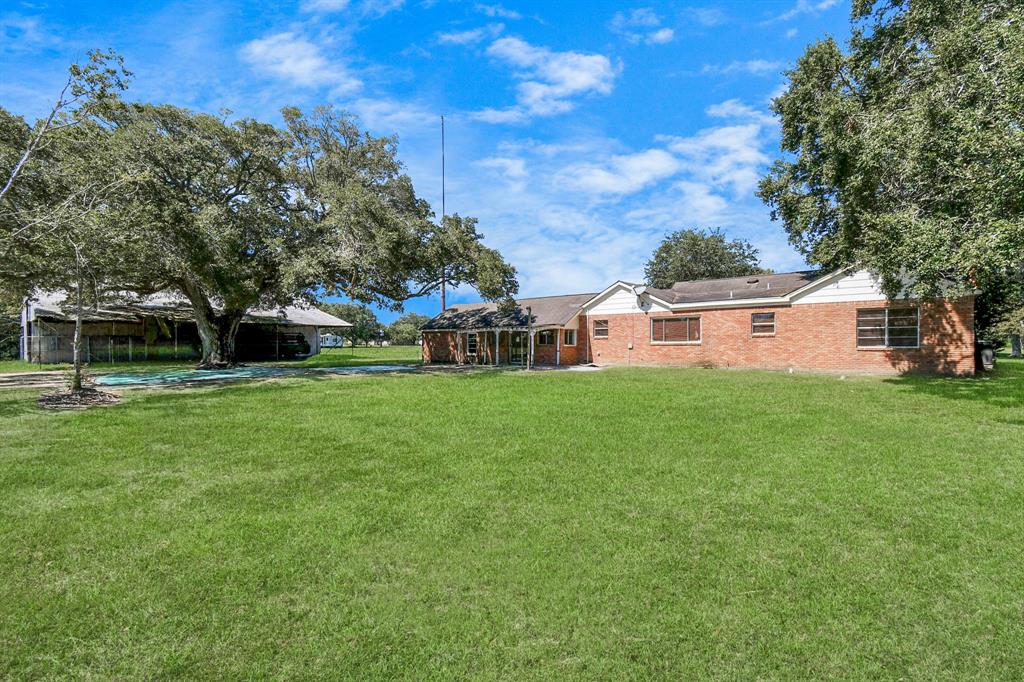 a view of a house with a big yard