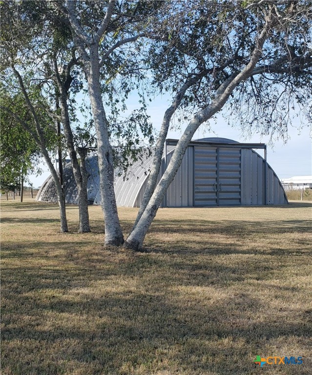 a view of a backyard of the house