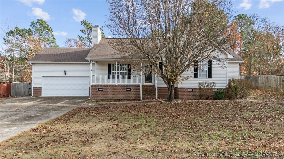 a house with a tree in front of it