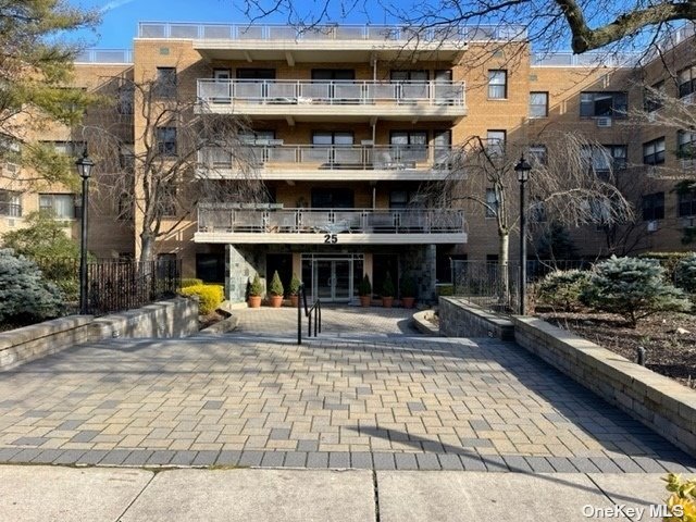 a view of a building with sitting area