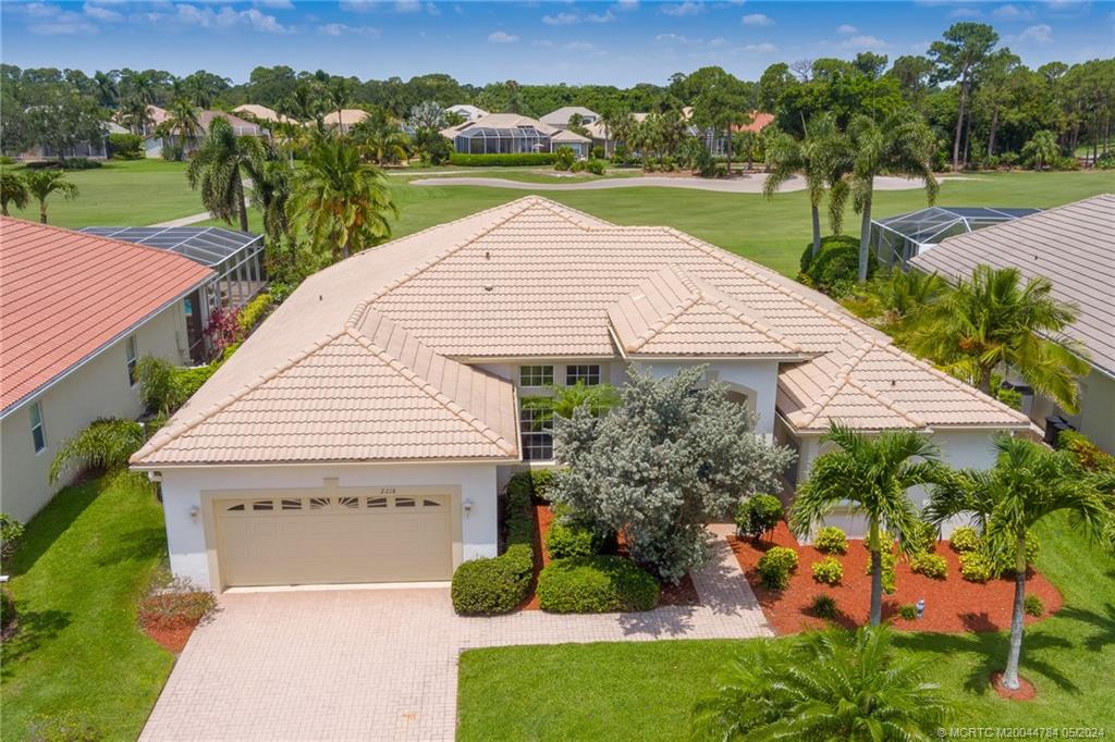 an aerial view of a house with big yard