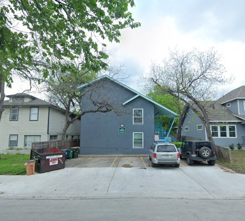 a view of a car parked in front of a house