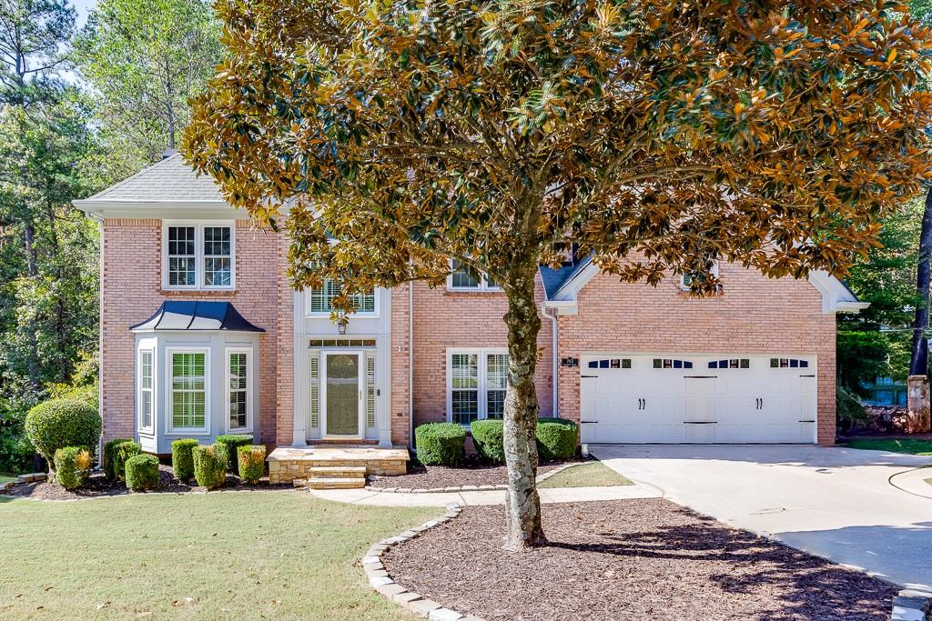 a front view of a house with a yard