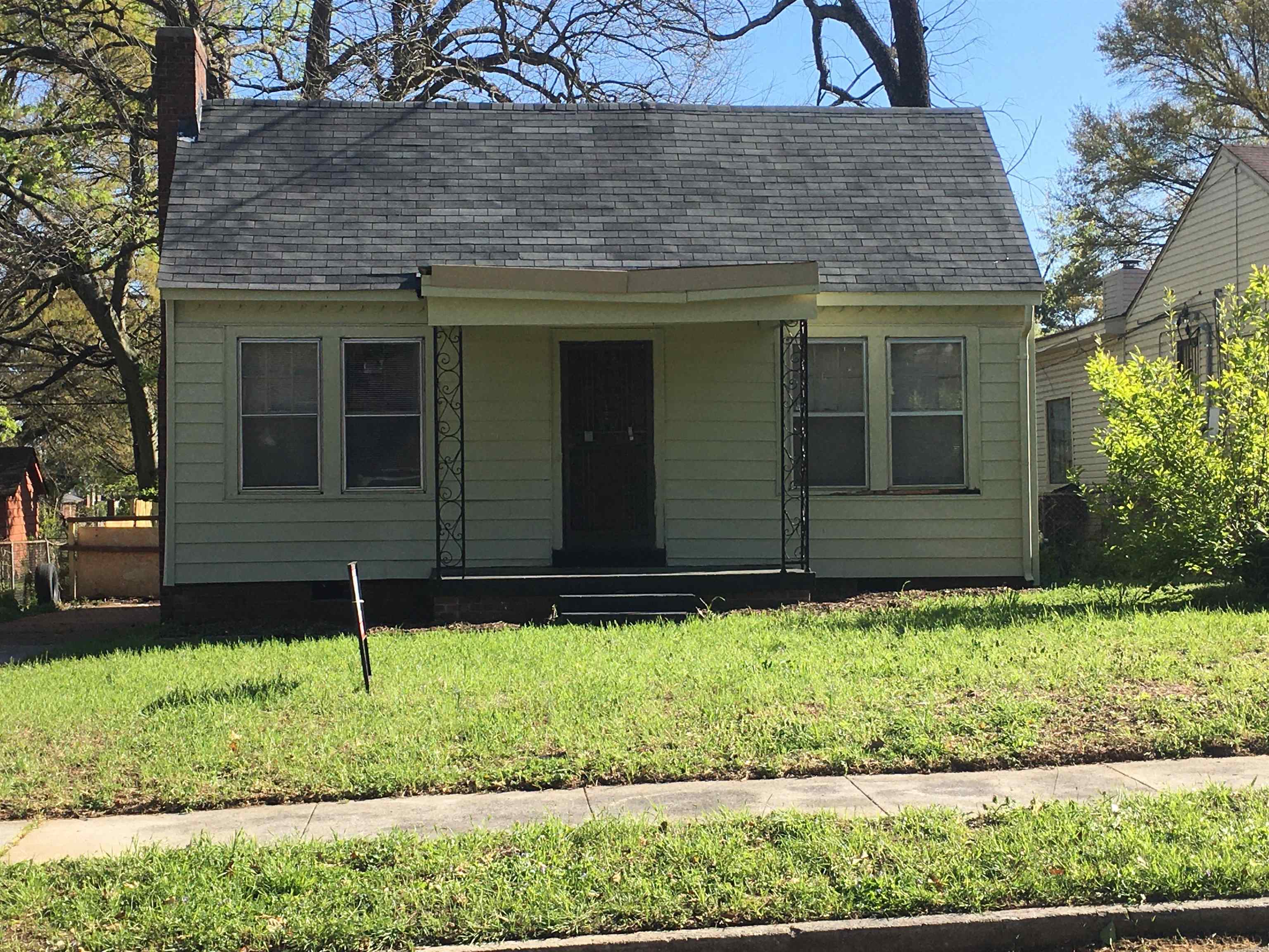 Bungalow-style home with a front yard