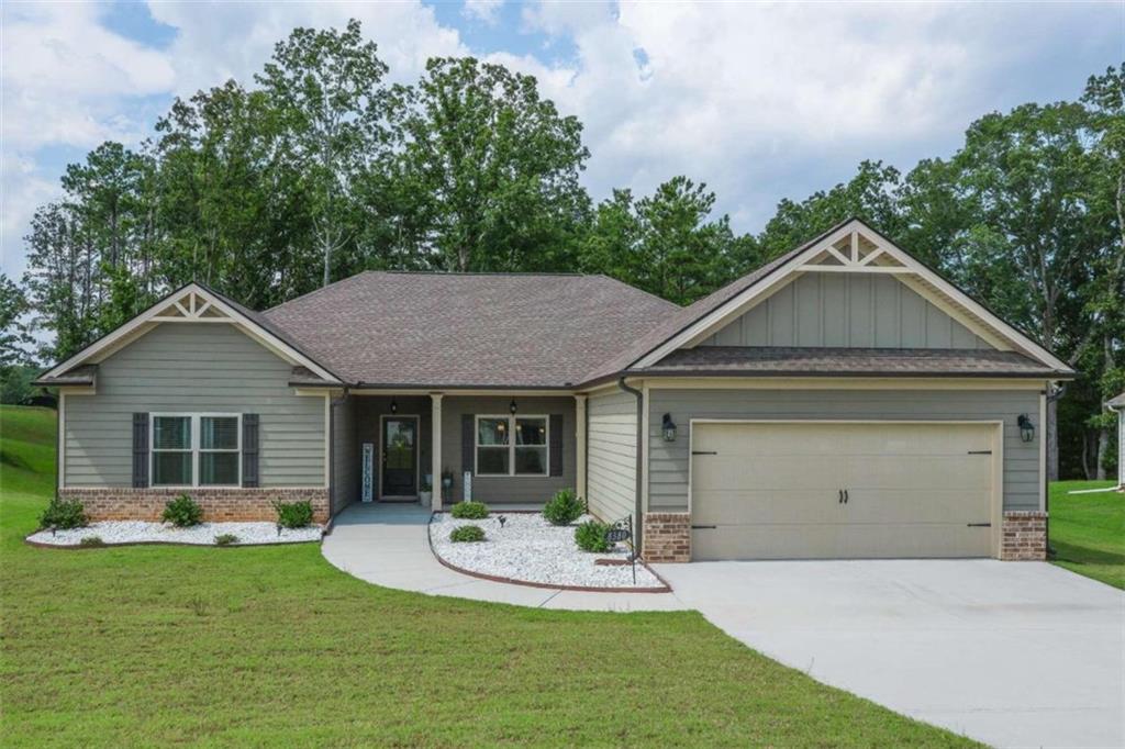 a front view of a house with a yard