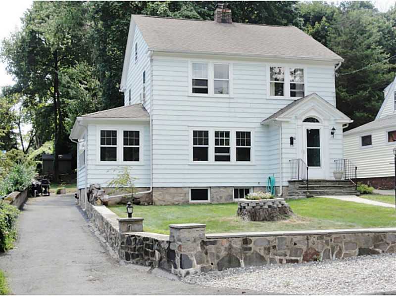 a aerial view of a house with a yard