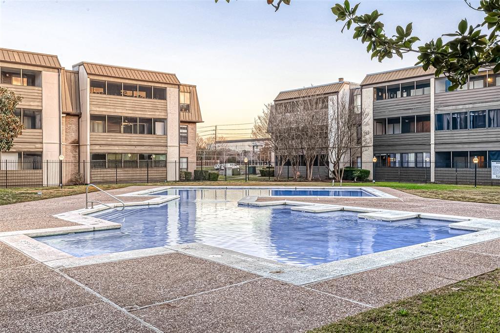 a view of large building with a swimming pool