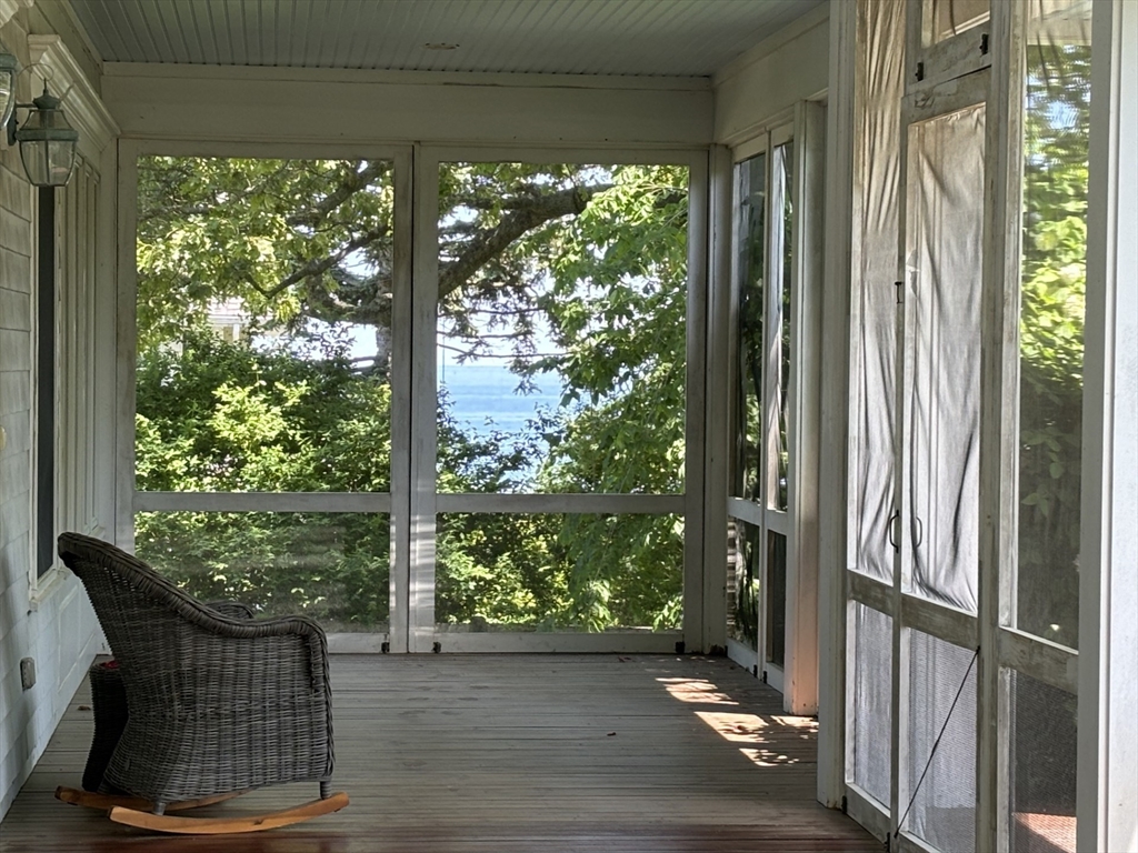 a view of balcony with furniture