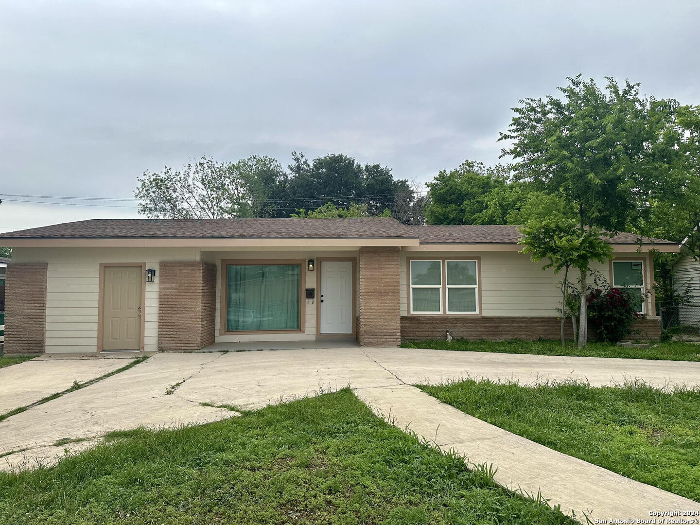 front view of a house with a yard