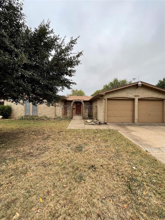 front view of a house with a dry yard