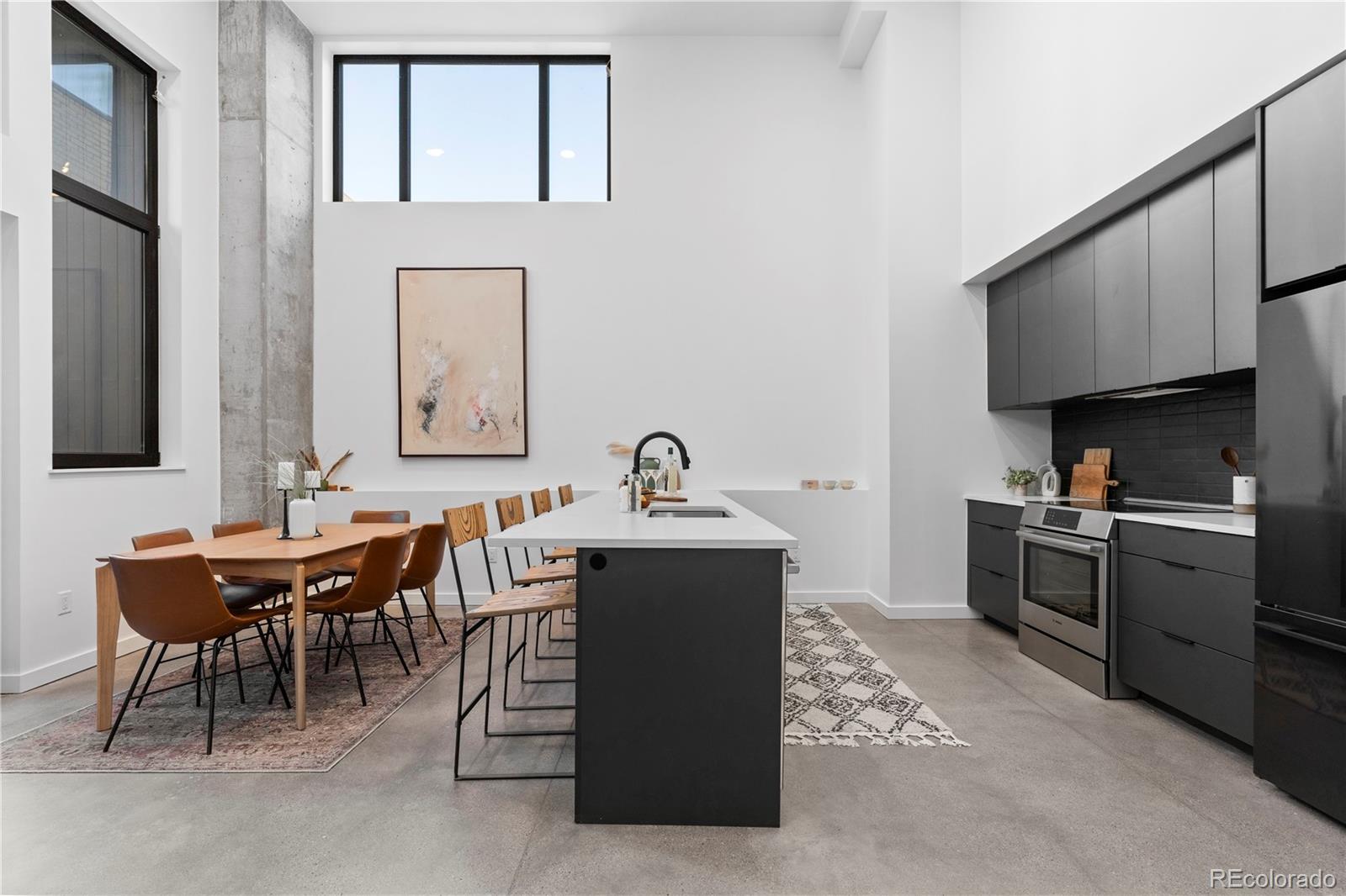 a kitchen with a sink and a stove top oven