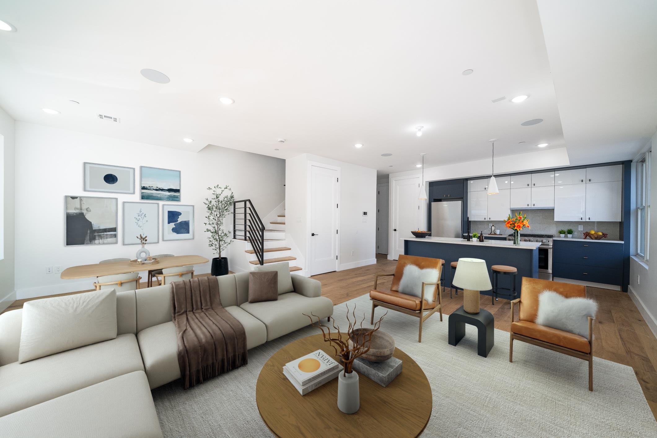 a living room with furniture kitchen view and a table