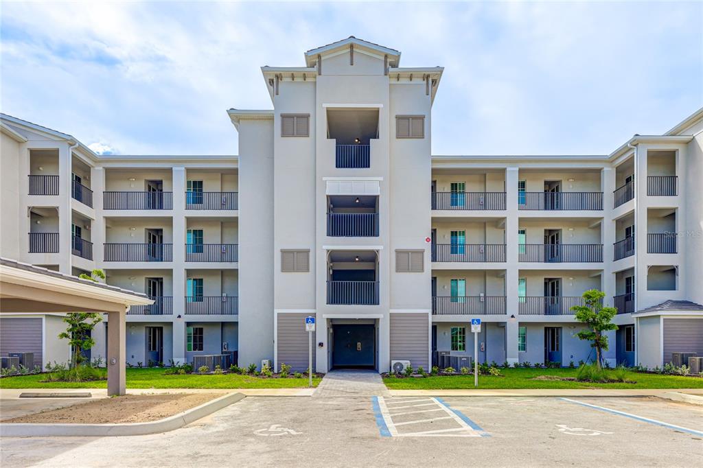 a view of a building with a yard