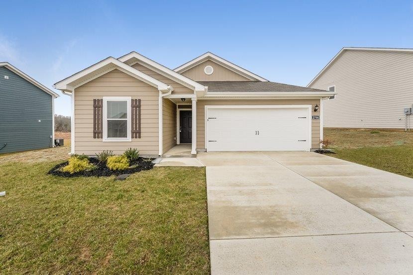 a front view of a house with yard