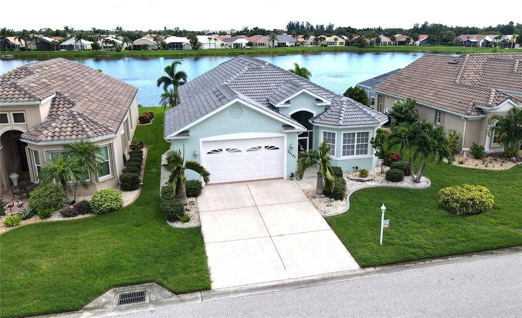 Aerial view of home and lake