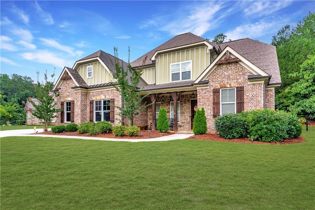 a front view of a house with a yard