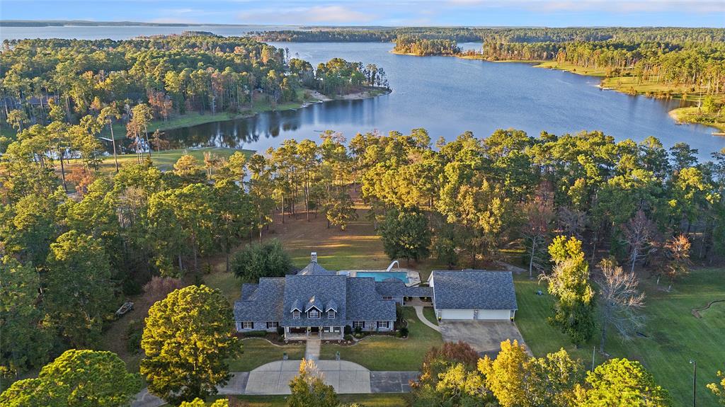 an aerial view of a house with a lake view