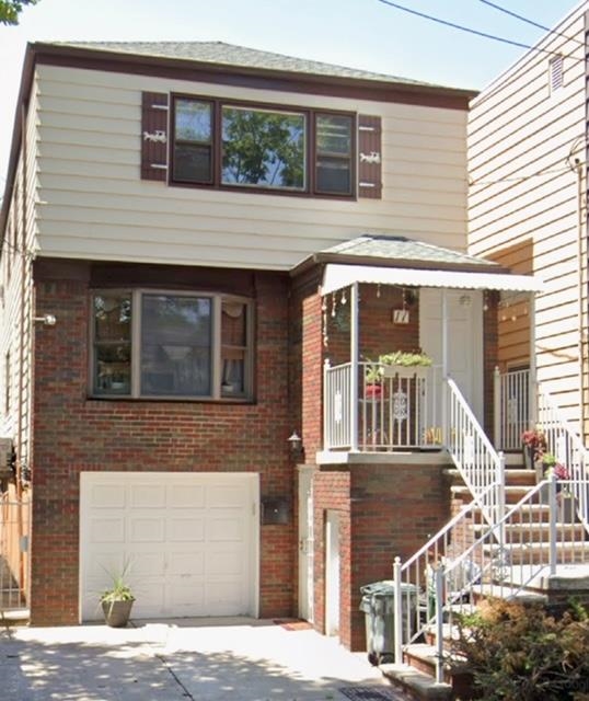 a front view of a house with a garage