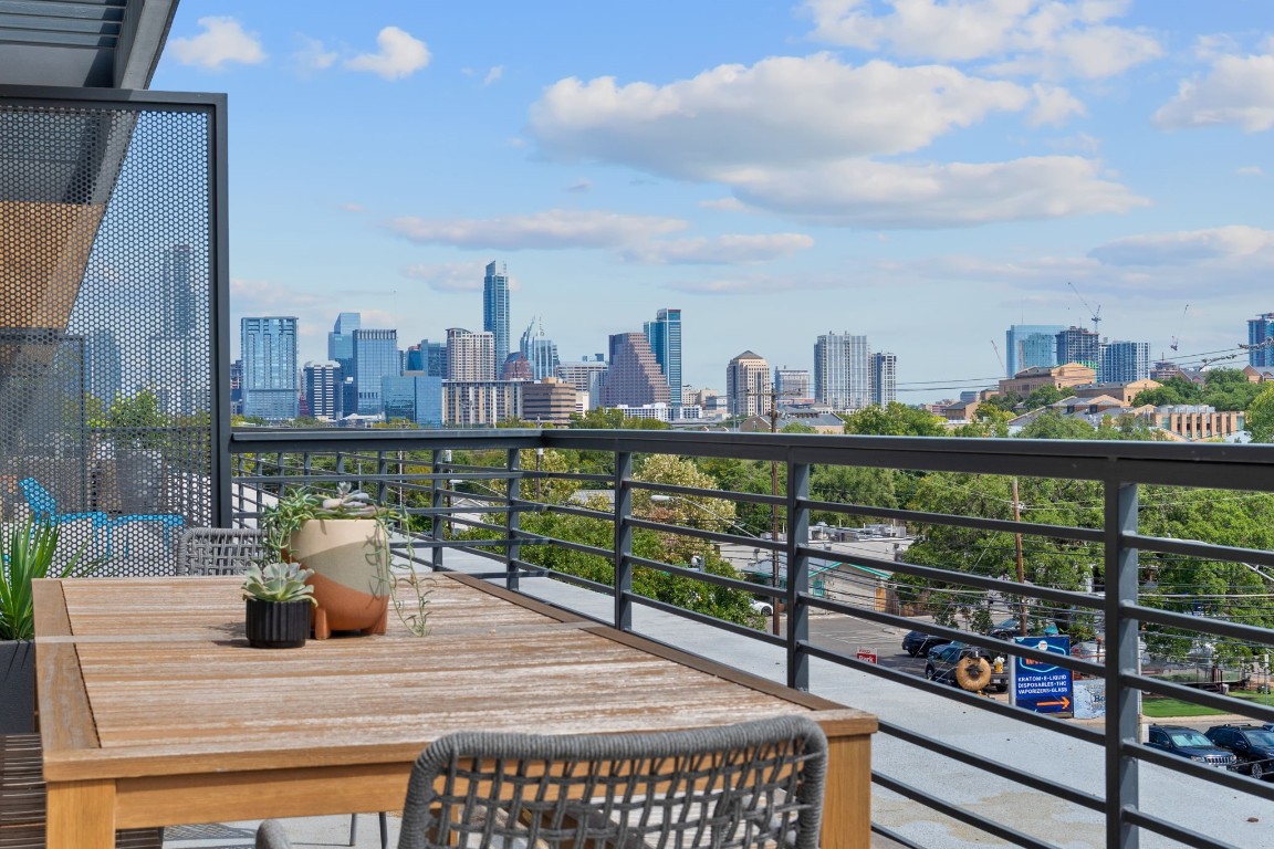 a view of a balcony with city view