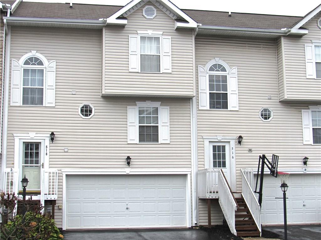 a front view of a house with stairs