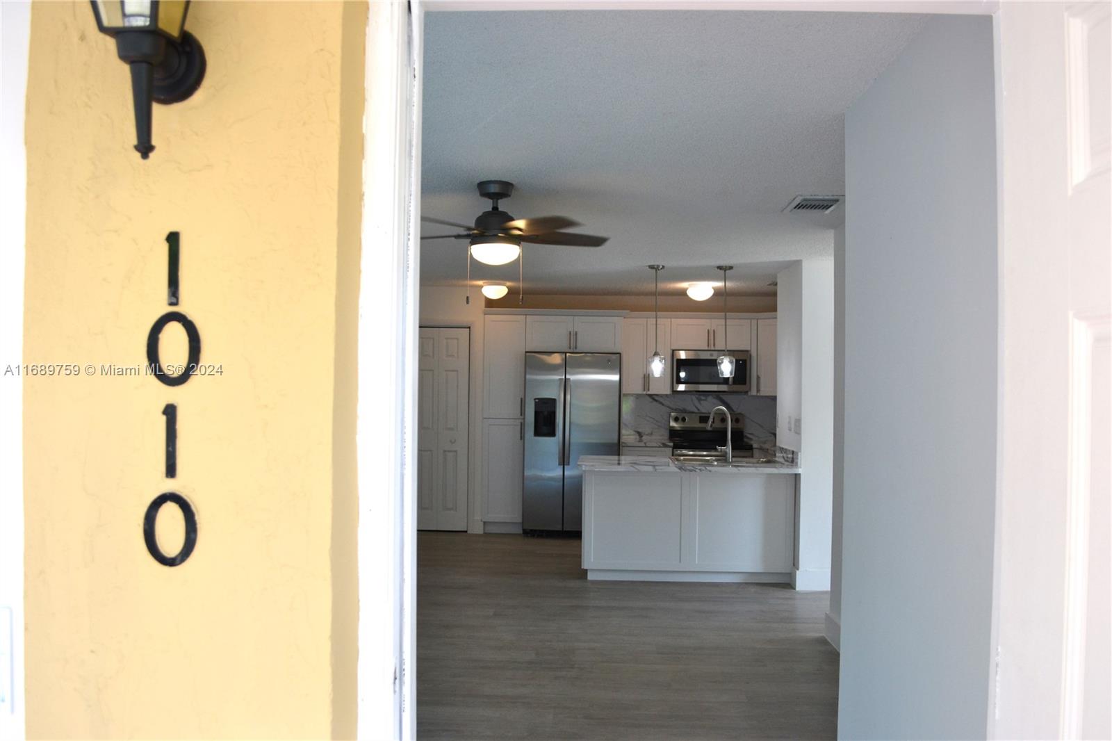 a view of a kitchen and a sink