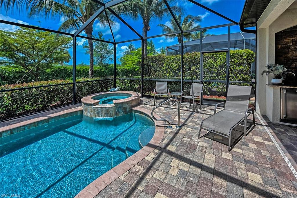 a view of a backyard with sitting area