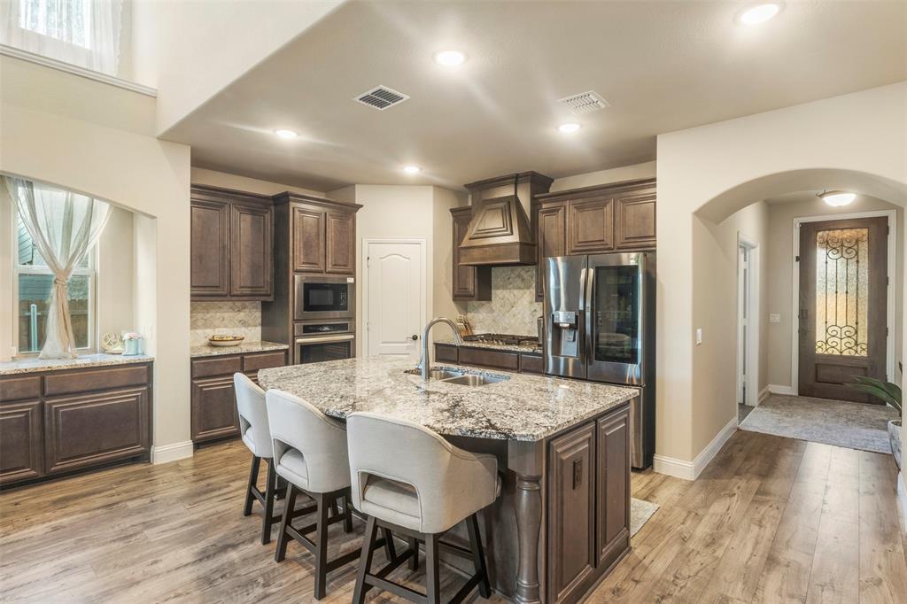 a kitchen with a table and chairs in it