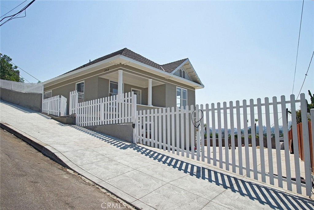 a view of a house with a small yard