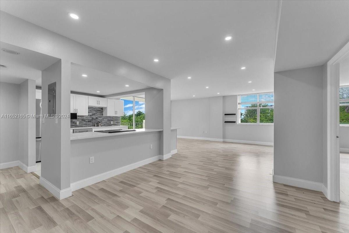 a view of kitchen with wooden floor