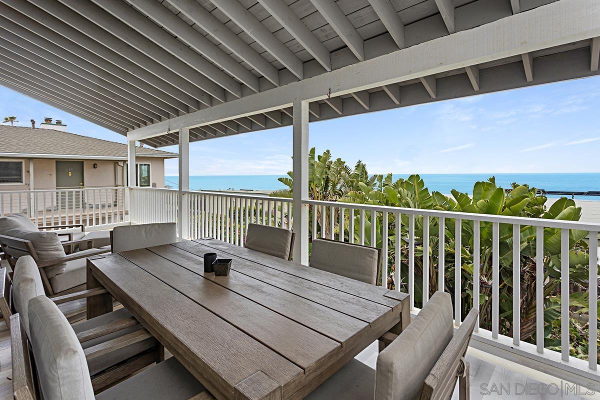 a view of a balcony with chairs