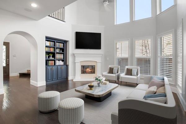 a living room with furniture fireplace and a flat screen tv