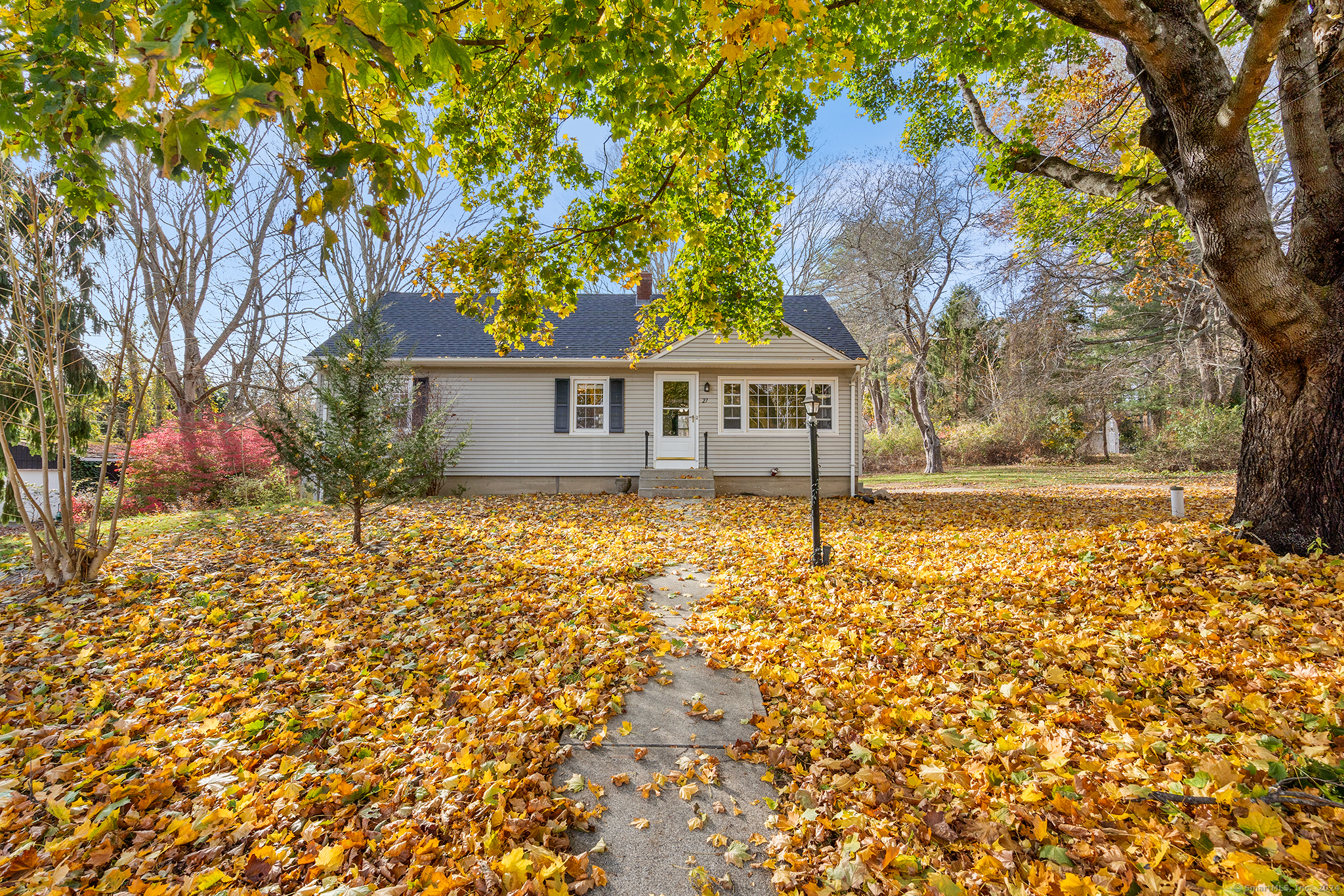 front view of a house with a yard