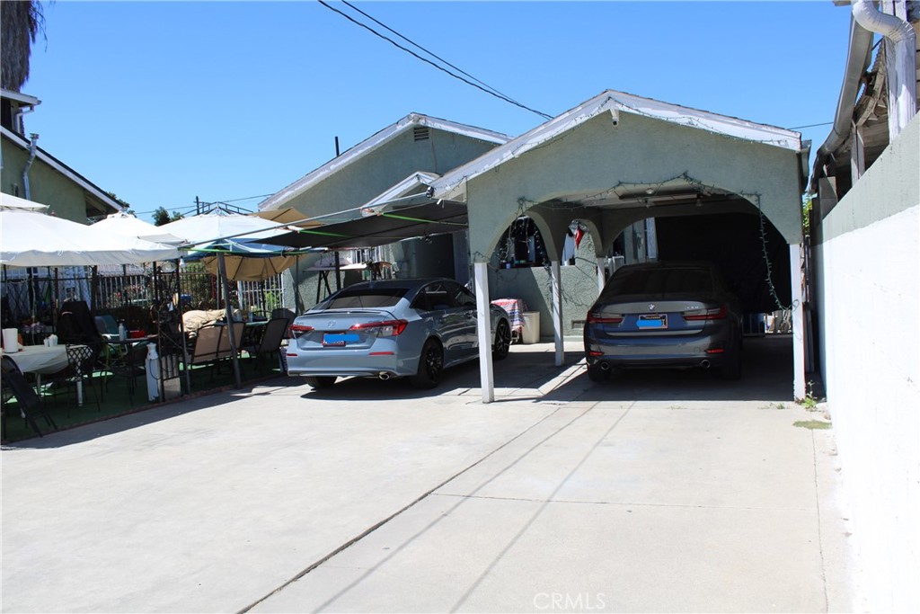 a view of a car park in front of retail shop