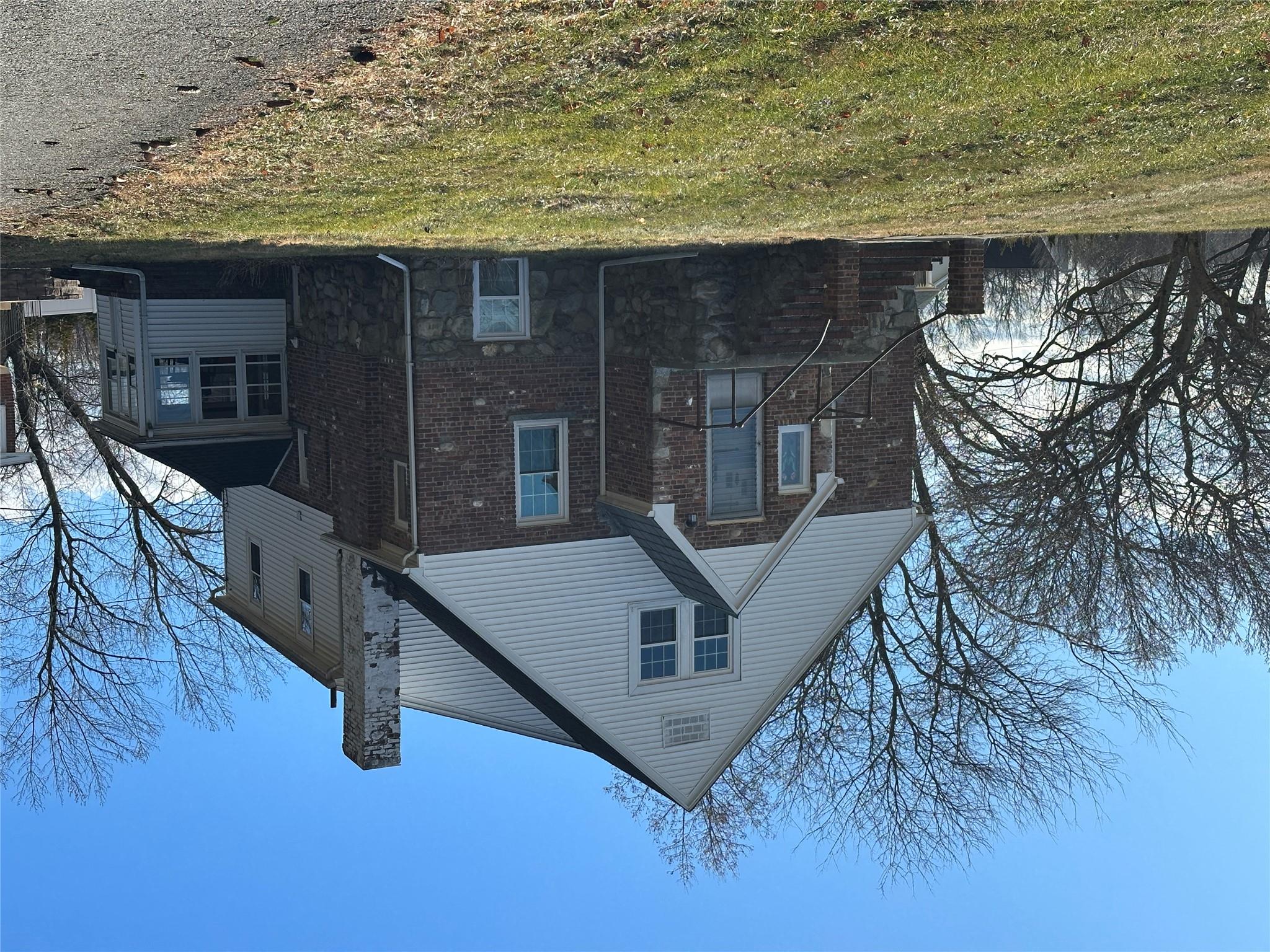 View of home's exterior featuring a yard