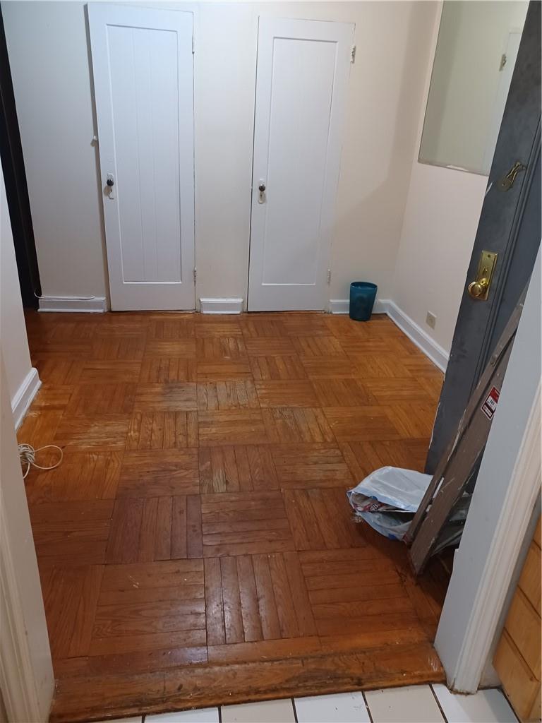 Washroom with light parquet flooring