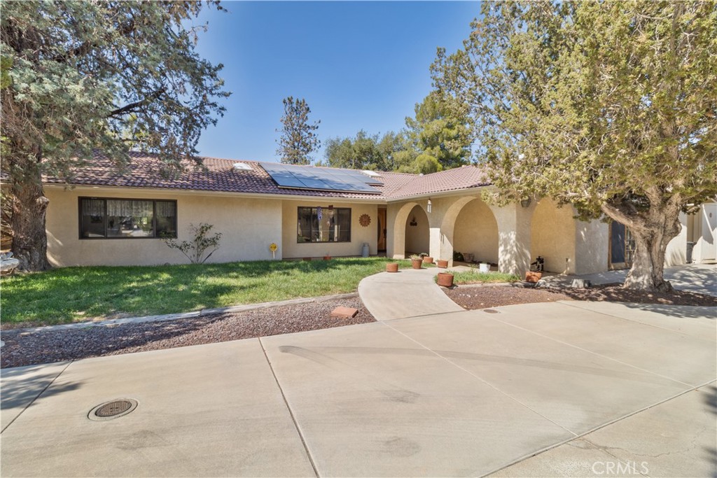 a front view of a house with a yard and a garage