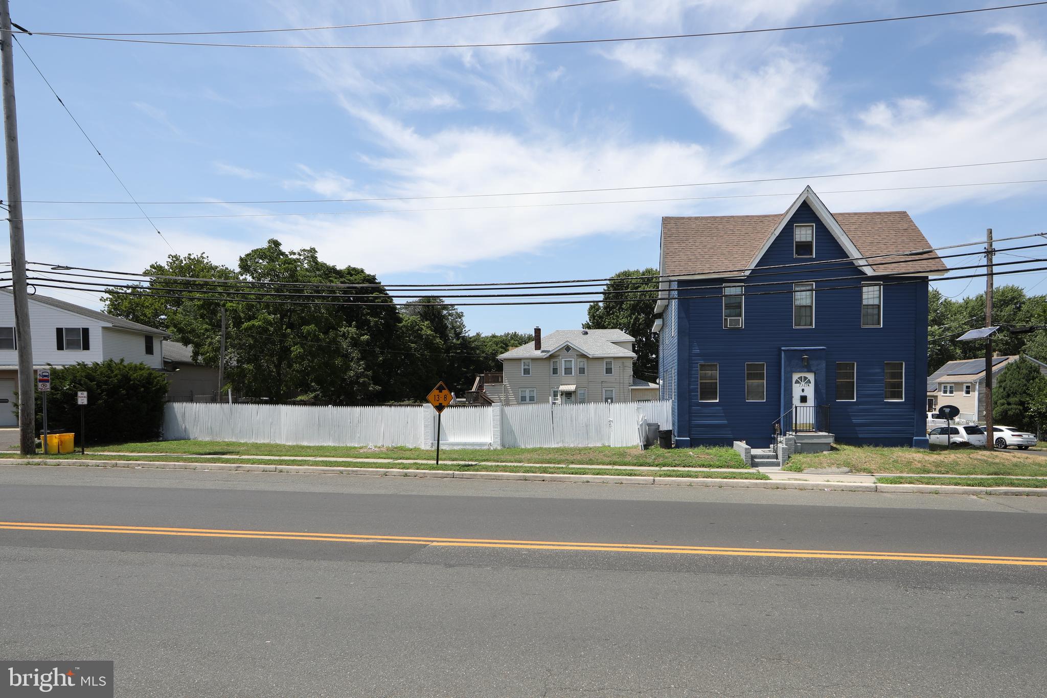 a view of street with a building in the background