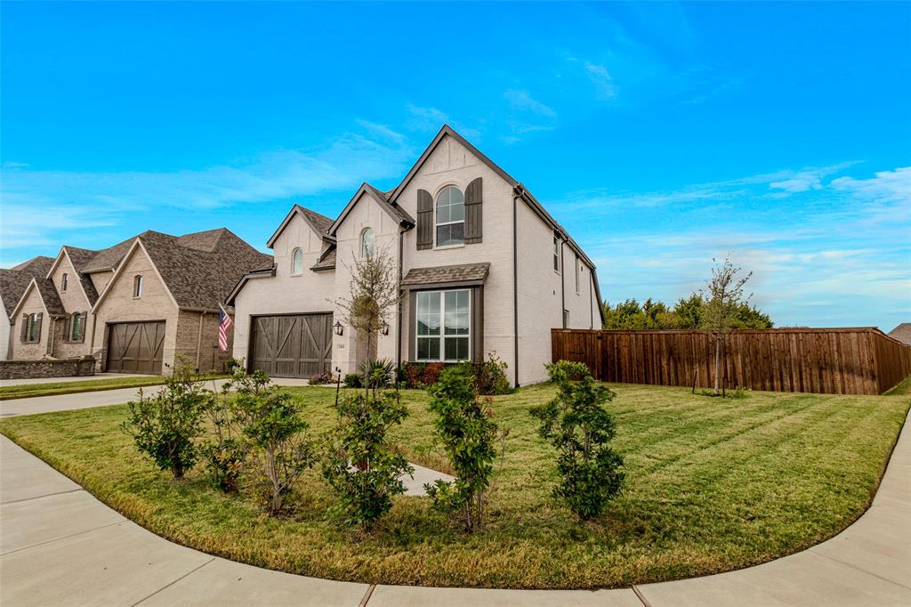 front view of a house with a garden