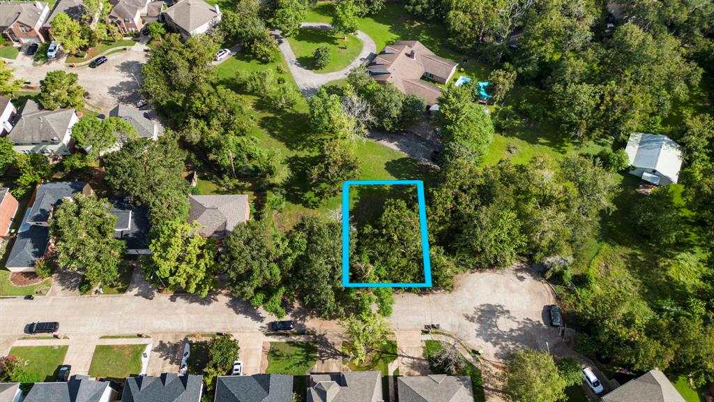 an aerial view of a house with a yard yard and outdoor seating