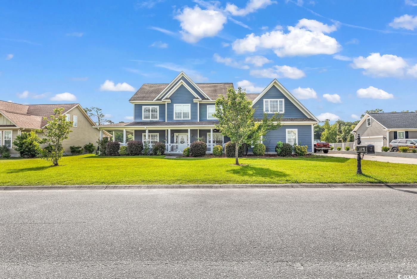 Craftsman house with a front yard and a porch